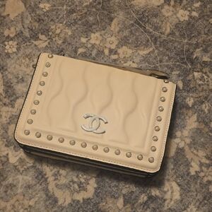 Elegant Cream Crossbody Bag with Silver Accents